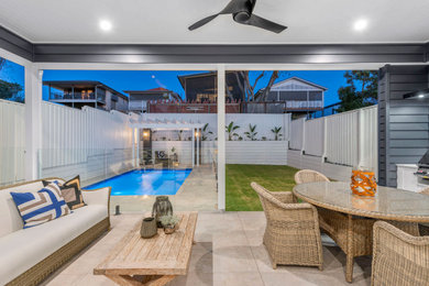 Inspiration for a medium sized classic back veranda in Brisbane with tiled flooring and a roof extension.