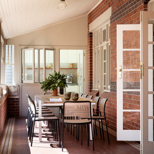 Photo of a transitional side yard verandah in Sydney with tile and a roof extension.
