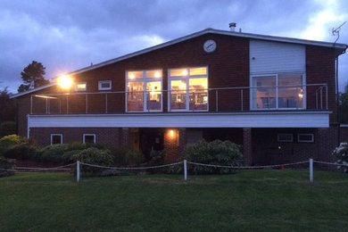 This is an example of a contemporary veranda in Kent.