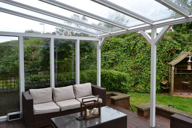 Medium sized contemporary back screened veranda in Devon with a pergola.