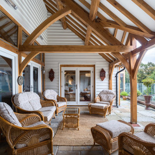 This is an example of a farmhouse veranda in Other.
