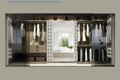 Design ideas for a small contemporary walk-in wardrobe in Hertfordshire with open cabinets, light wood cabinets, light hardwood flooring and white floors.