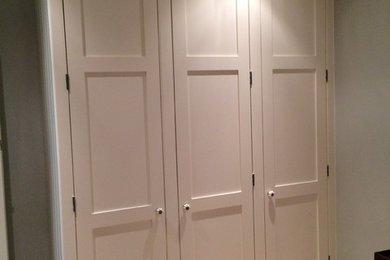 Inspiration for a contemporary wardrobe in Other with shaker cabinets and white cabinets.