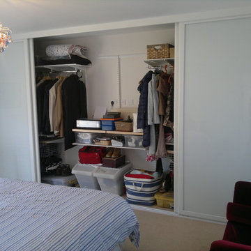 Sliding wardrobe doors with mirror and white glass panels