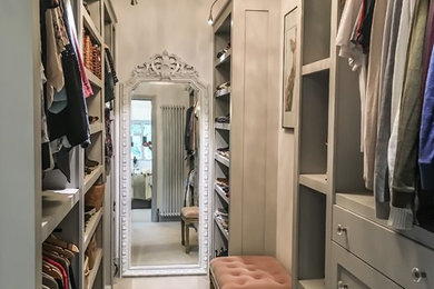Example of a transitional closet design in Surrey