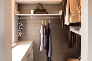 Photo of a contemporary gender neutral walk-in wardrobe in Other with open cabinets.