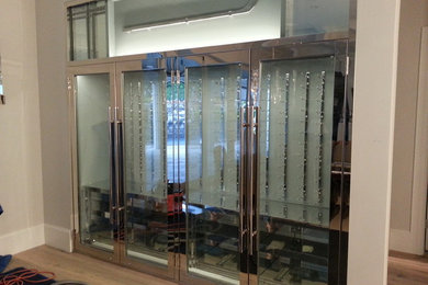 Example of a small minimalist wine cellar design in Miami