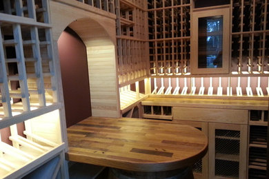 Wine cellar - large traditional wine cellar idea in Miami with storage racks