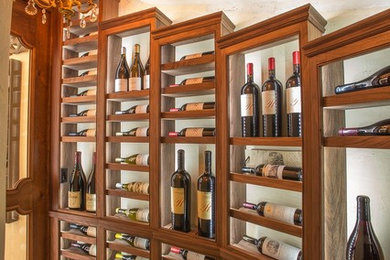 Example of an arts and crafts wine cellar design in San Francisco with display racks