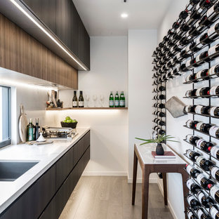 Design ideas for a mid-sized contemporary wine cellar in Gold Coast - Tweed with medium hardwood floors, storage racks and brown floor.