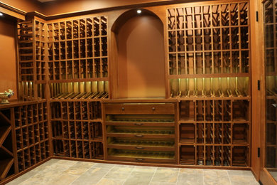 Design ideas for a medium sized classic wine cellar in Cincinnati with porcelain flooring and display racks.