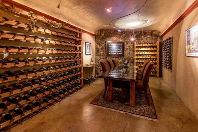 Example of a tuscan wine cellar design in Portland