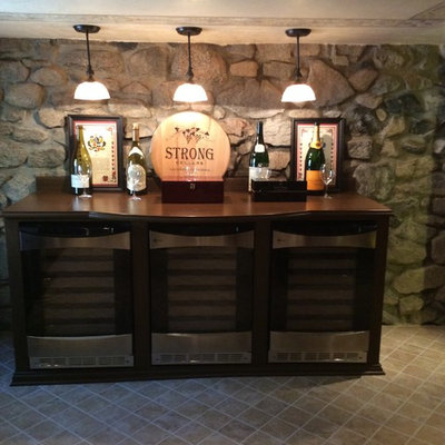 Inspiration for a large craftsman wine cellar remodel in Los Angeles with display racks