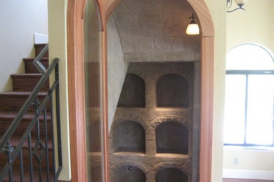 This is an example of a medium sized rustic wine cellar in San Francisco.