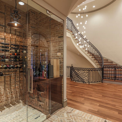 Example of a classic brick floor and beige floor wine cellar design in Dallas with storage racks