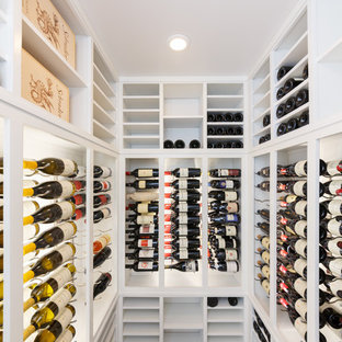Inspiration for a mid-sized contemporary marble floor wine cellar remodel in New York with storage racks