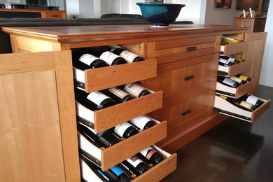 Example of an arts and crafts wine cellar design in Phoenix