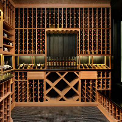 Transitional black floor wine cellar photo in Chicago with storage racks