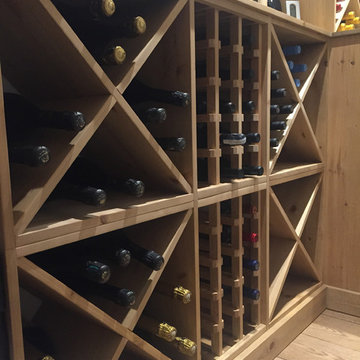 Compact wine room in Henley on Thames using case racks, cubes and shelves