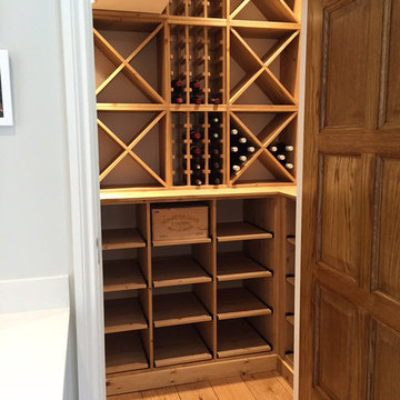 Compact wine room in Henley on Thames using case racks, cubes and shelves