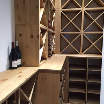 Compact wine room in Henley on Thames using case racks, cubes and shelves