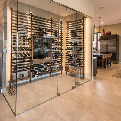 Wine cellar - large contemporary beige floor and porcelain tile wine cellar idea in Phoenix with display racks