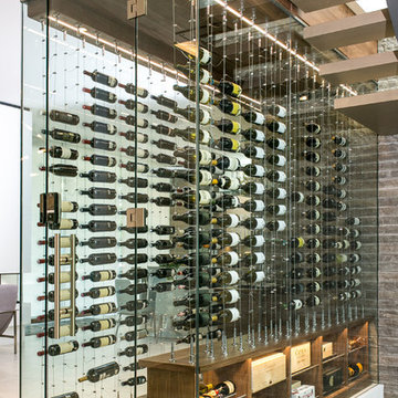 Contemporary Under-the-Stairs Wine Cellar featuring the Cable Wine System