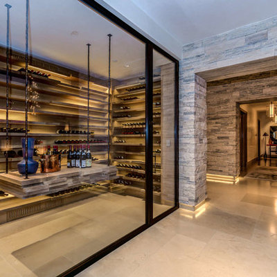 Inspiration for a large contemporary beige floor and porcelain tile wine cellar remodel in Philadelphia with storage racks