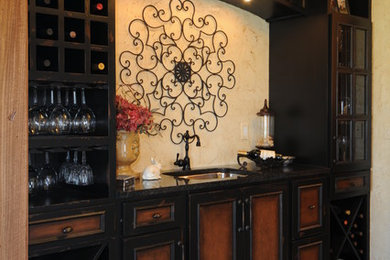Wine cellar - mid-sized rustic ceramic tile wine cellar idea in Chicago with display racks