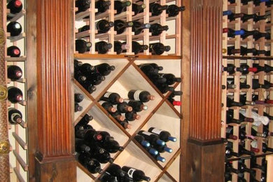 Wine cellar - huge wine cellar idea in Little Rock with storage racks