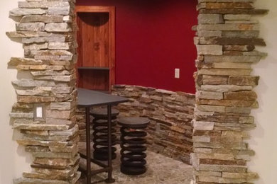Wine cellar - mid-sized industrial limestone floor wine cellar idea in Indianapolis with display racks