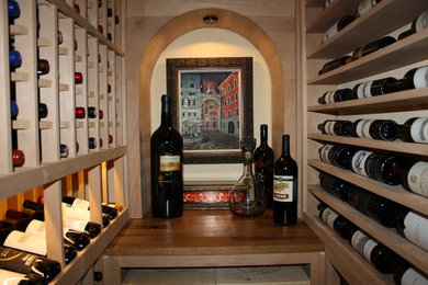 Inspiration for a small timeless wine cellar remodel in Los Angeles with storage racks