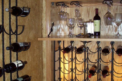 Example of a mid-sized classic wine cellar design in Other with storage racks