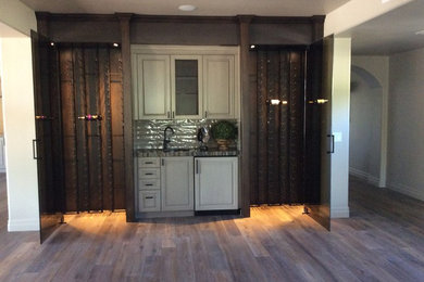 Inspiration for a large craftsman wine cellar remodel in Phoenix with storage racks