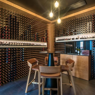 Design ideas for an expansive contemporary wine cellar in Sunshine Coast with ceramic floors, display racks and grey floor.