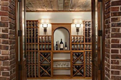 Large mountain style wine cellar photo in Minneapolis with diamond bins