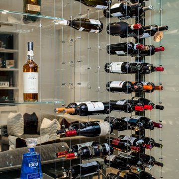 Glass encased Wine Cellar featuring CABLE WINE SYSTEMS®
