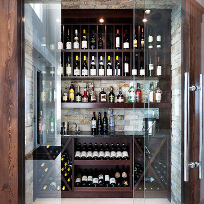 Wine cellar - contemporary white floor wine cellar idea in Vancouver with display racks