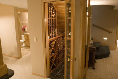 Photo of a small traditional wine cellar in Minneapolis with ceramic flooring and display racks.