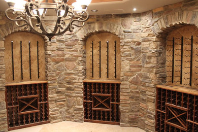 Example of a huge classic wine cellar design in Denver with display racks