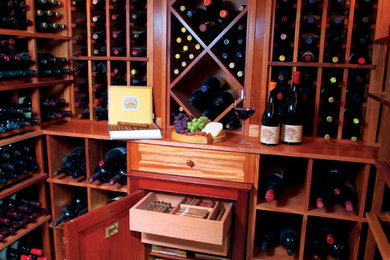 This is an example of a classic wine cellar in New York with storage racks and blue floors.