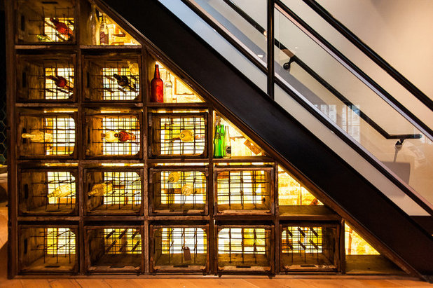 Industrial Wine Cellar by Beyond Beige Interior Design Inc.