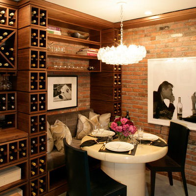 Example of a transitional wine cellar design in New York with storage racks