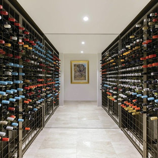 Inspiration for a mid-sized contemporary wine cellar in Melbourne with marble floors, storage racks and beige floor.