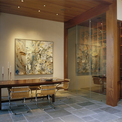 Minimalist slate floor wine cellar photo in San Francisco with storage racks