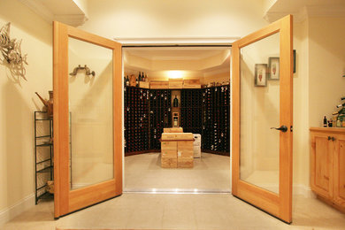 Mid-sized travertine floor wine cellar photo in New York with storage racks