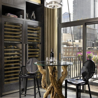 Inspiration for an industrial gray floor wine cellar remodel in Chicago with storage racks