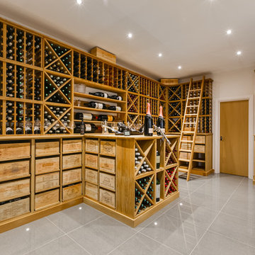 Large private wine room in Wimbledon, London using solid Oak racking