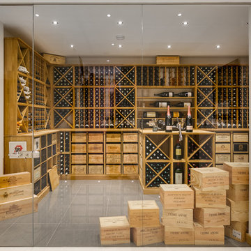 Large private wine room in Wimbledon, London using solid Oak racking