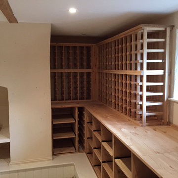 Large wine room using solid pine racking in Hampshire
